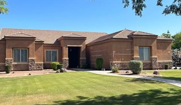 Residential exterior repaint — garage and trim