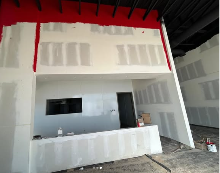 Residential exterior repaint — patio and red ceiling detail